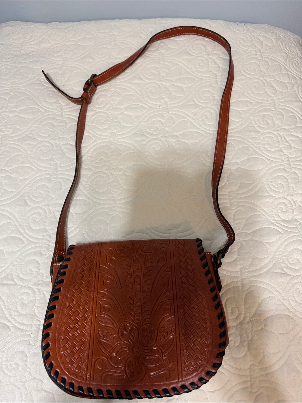 Women's Brown Leather Crossbody Bag with Floral Tooled Design. Patricia Nash
